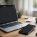 A laptop and smartphone on a desk, both showing a screen recording timer with a red record dot