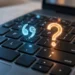 Illustration of a laptop keyboard with mismatched characters glowing above the keys, showing why a keyboard types the wrong characters