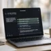 Laptop showing an AI assistant working through a multi-step task checklist, marking items complete one by one