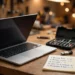 A laptop on a repair workbench beside a screwdriver set, USB drive and a handwritten preparation checklist