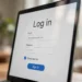 Close-up of a laptop screen showing a login form with a checked Remember me checkbox