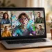 Laptop showing a video call with one participant's video frozen and pixelated, illustrating upload-speed problems during video calls
